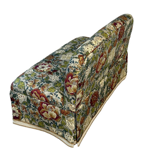 Floral-patterned settee on a white background