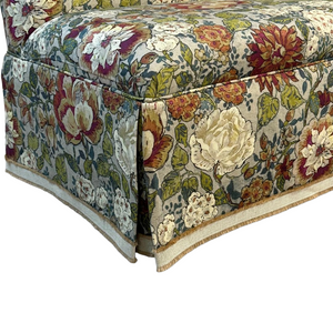 Floral patterned settee with a white background