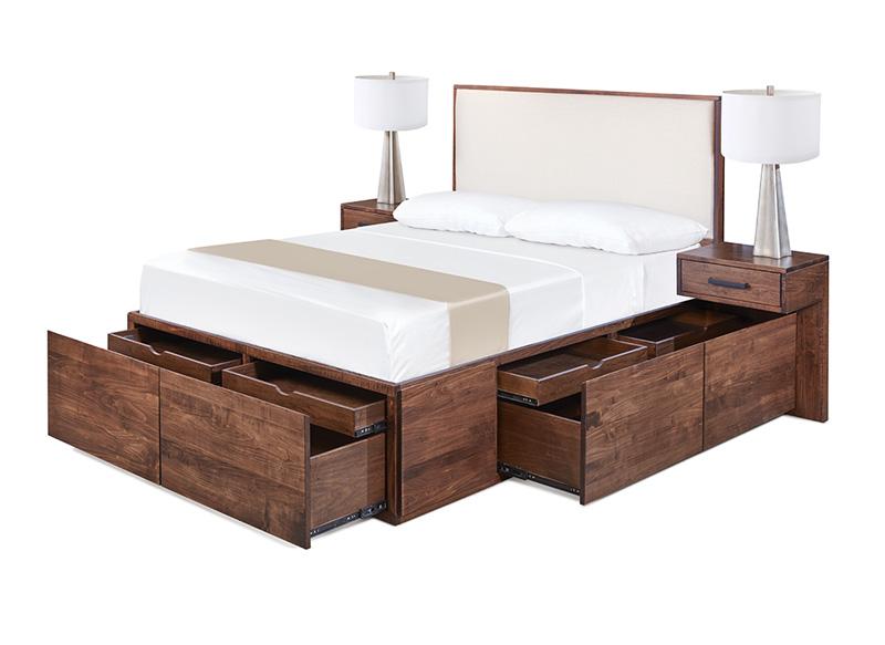 Solid wood bed shown in walnut with 12 large integrated storage drawers - shown open.